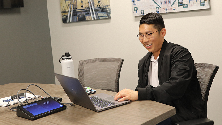 Male employee working at a conference table